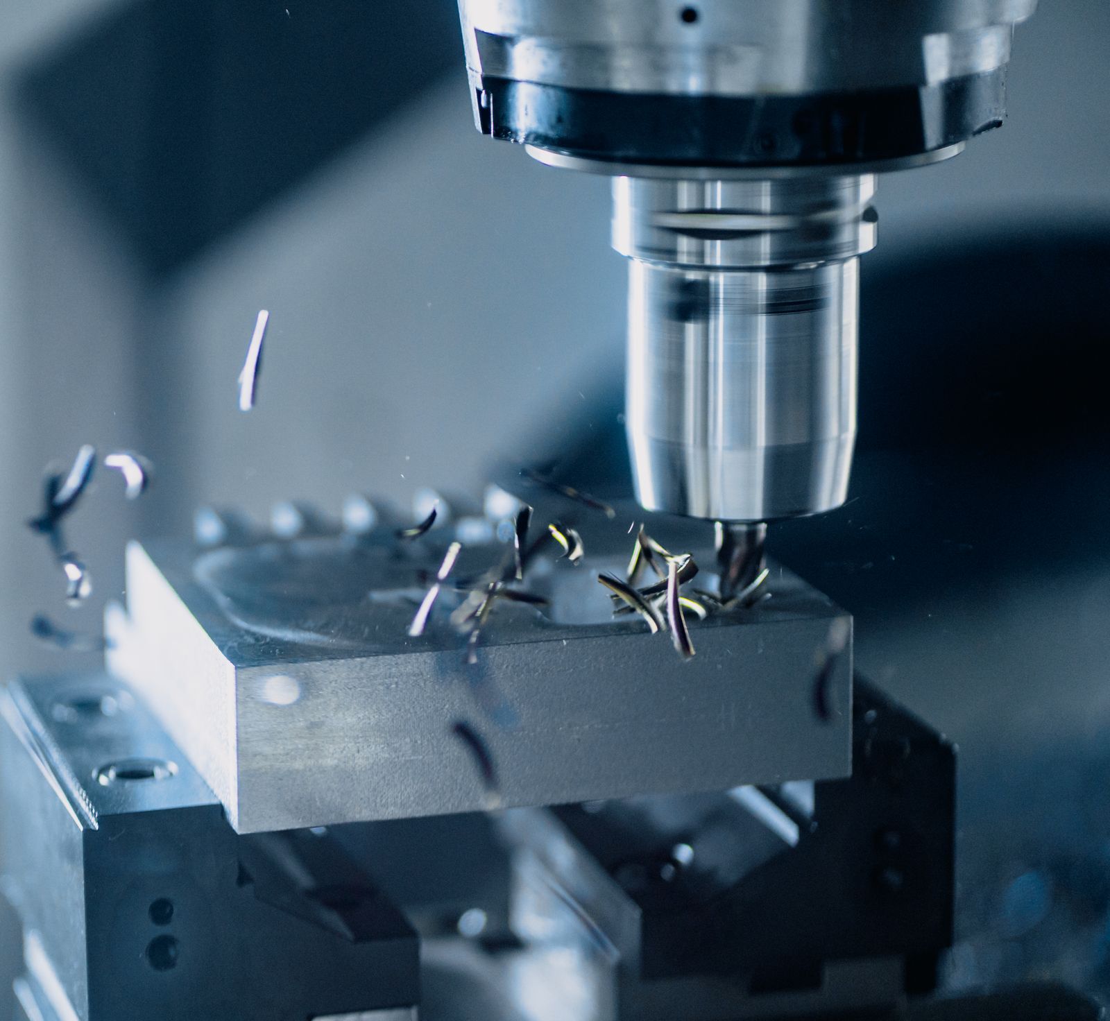 Close-up of a CNC milling machine cutting a metal workpiece