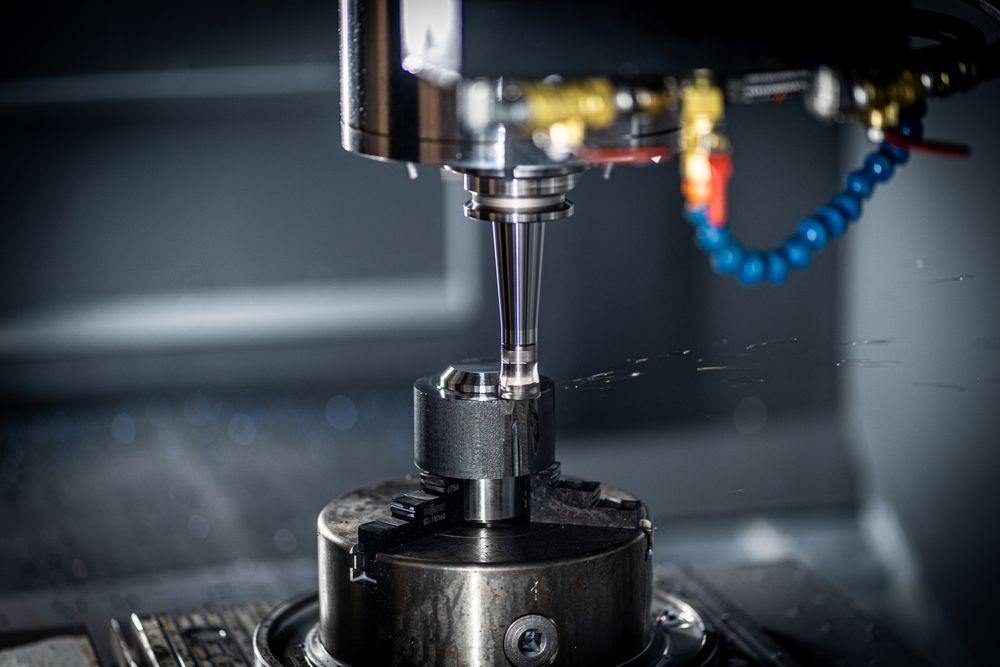Precision milling machine shaping a custom metal component